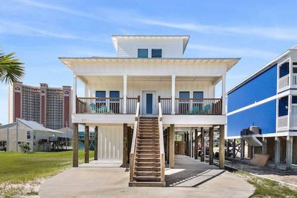 gulf shores vacation home view from front with stairs leading up to patio