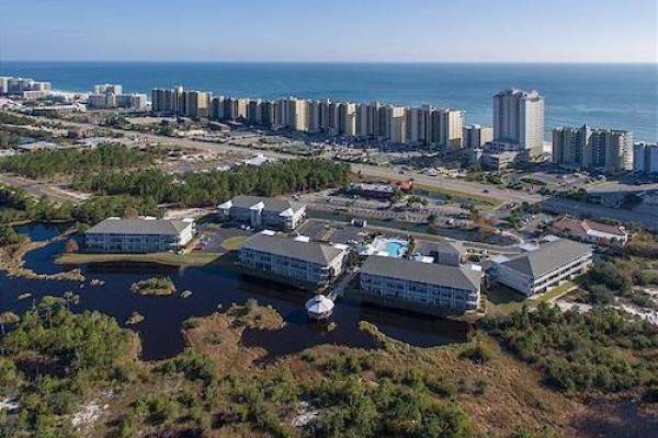 view of Romar Lakes from the sky with the Gulf of Mexico in the background in Alabama view of Romar Lakes from the sky with the Gulf of Mexico in the background in Alabama